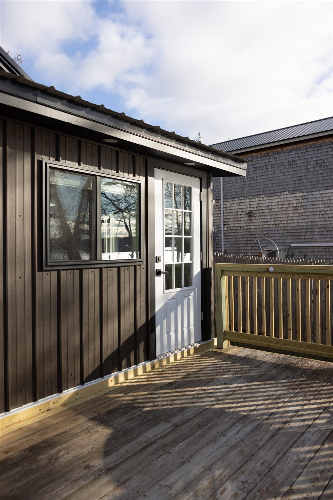Deck entrance with railing and white door
